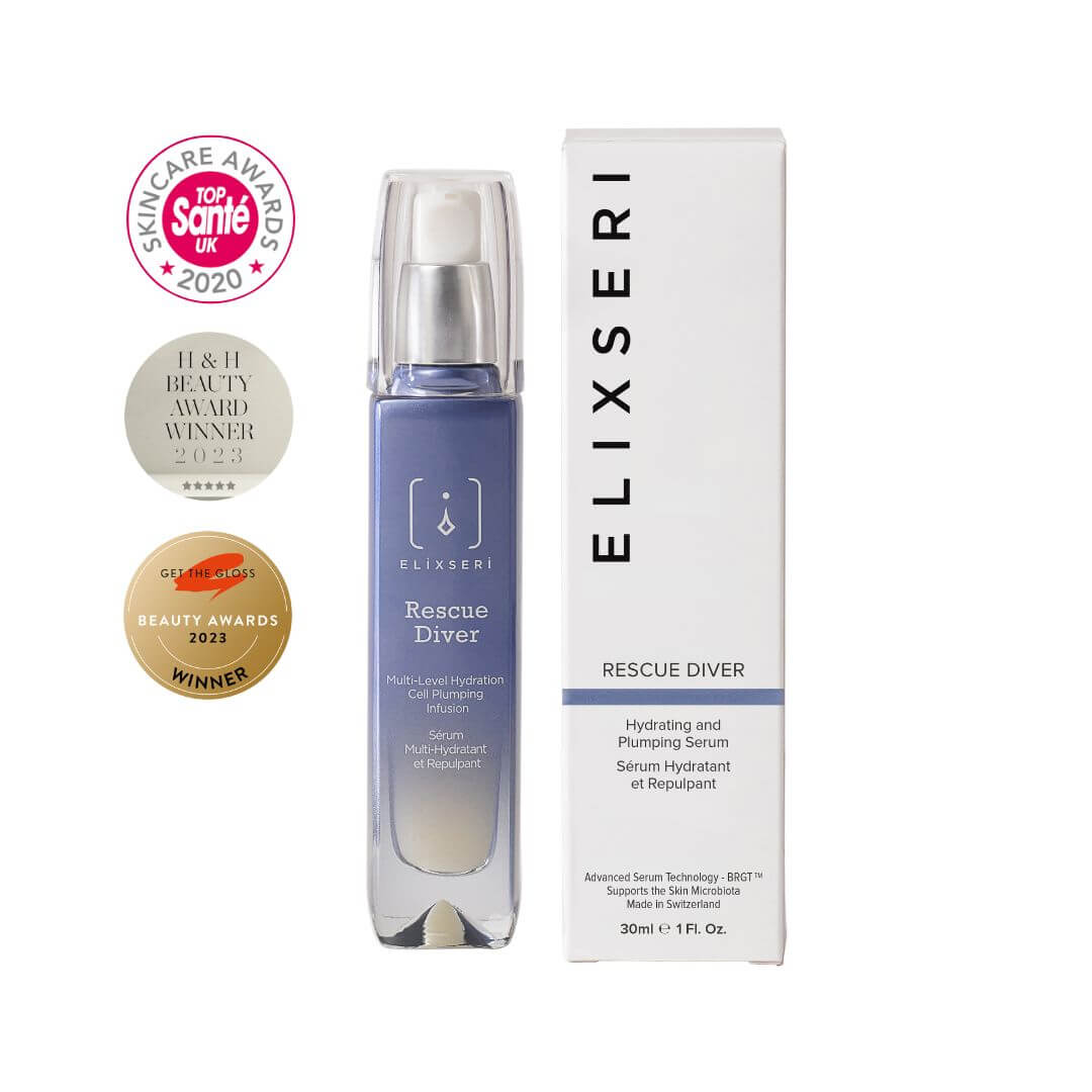A blue glass bottle of Elixseri Rescue Diver hydrating serum pictured next to it's box with it's award logos