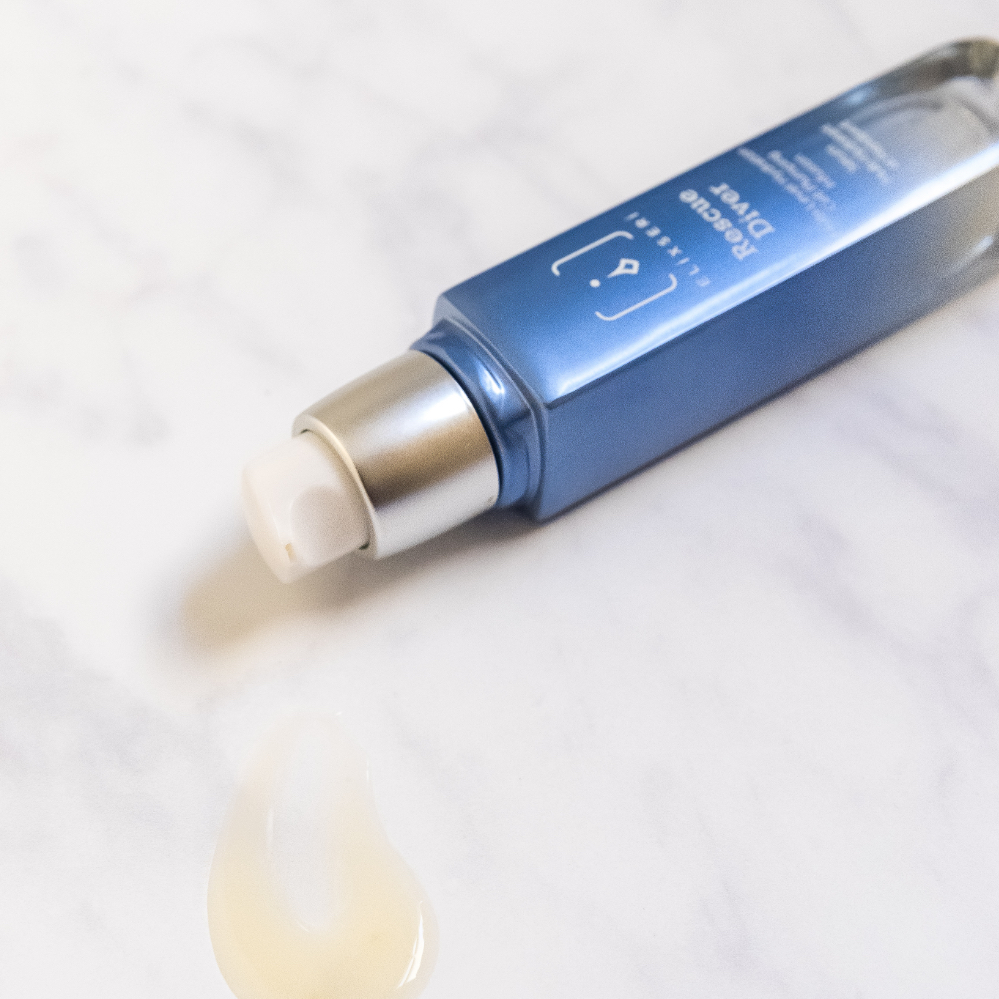 Elixseri's Rescue Diver hydrating serum laying on it's side with gel like serum visible.