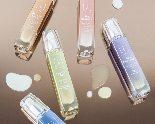 Elixseri serums laid down on a shiny surface with their creamy serum textures