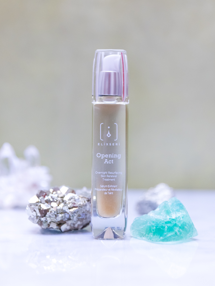 Elixseri Opening Act anti-ageing serum standing amongst silver and turquoise crystals. Overnight resurfacing skin renewal treatment.
