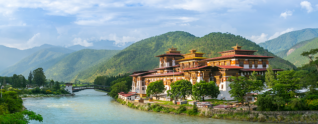 Riverside view of Bhutan's traditional buildings