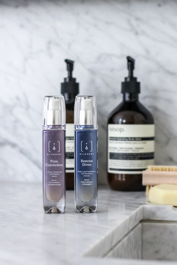 Firm Conviction serum and Rescue Diver serum sat side by side on a bathroom sink as part of a morning skincare routine