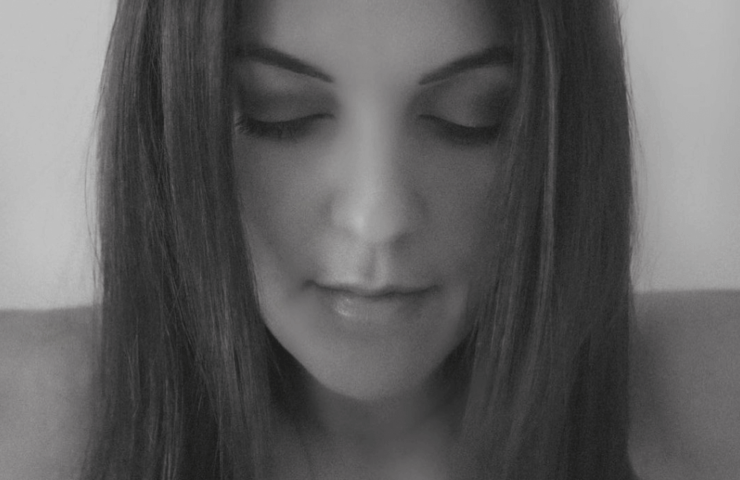 A black and white photograph of German blogger Georgina Moreno looking down