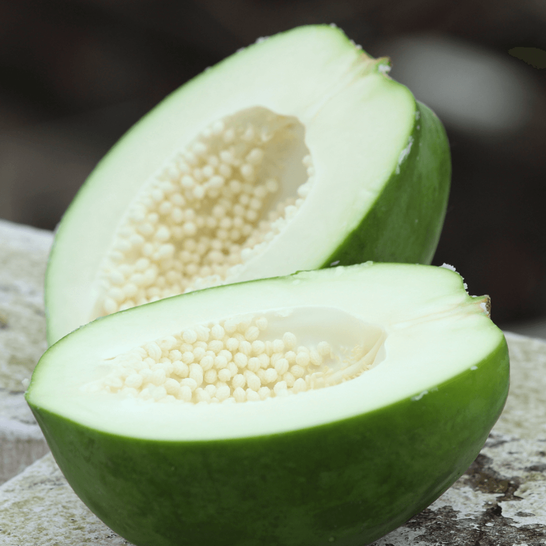 Green papaya cut in half