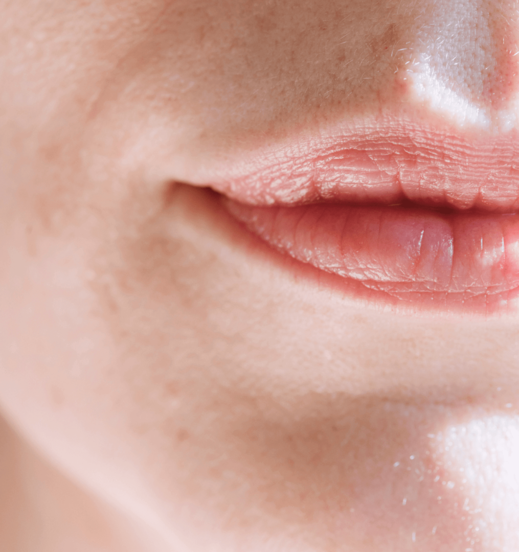 Close up of a woman's pale sensitive skin and lips
