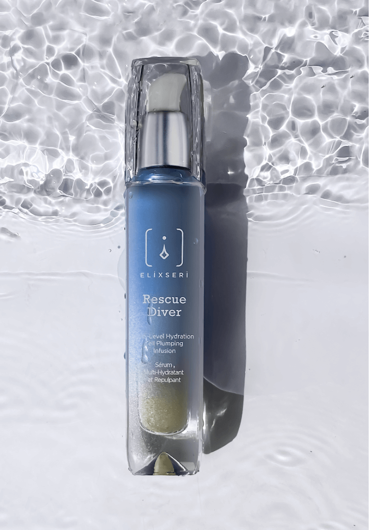 A blue bottle of Elixseri Rescue Diver serum in a background of Swiss Alpine Light Water which is at the heart of each Elixseri serum.